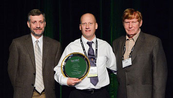 Tom Nielson, Louisville Bats Baseball Club, receives the Dick Ericson Award.