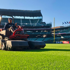 Seattle Mariners Director of Grounds Kevin Dvorak rides a Toro Sidewinder, mowing the outfield grass at T-Mobile Park. (Photo Courtesy of Seattle Mariners)